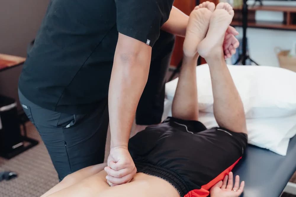 Manual therapy on a client’s shoulder