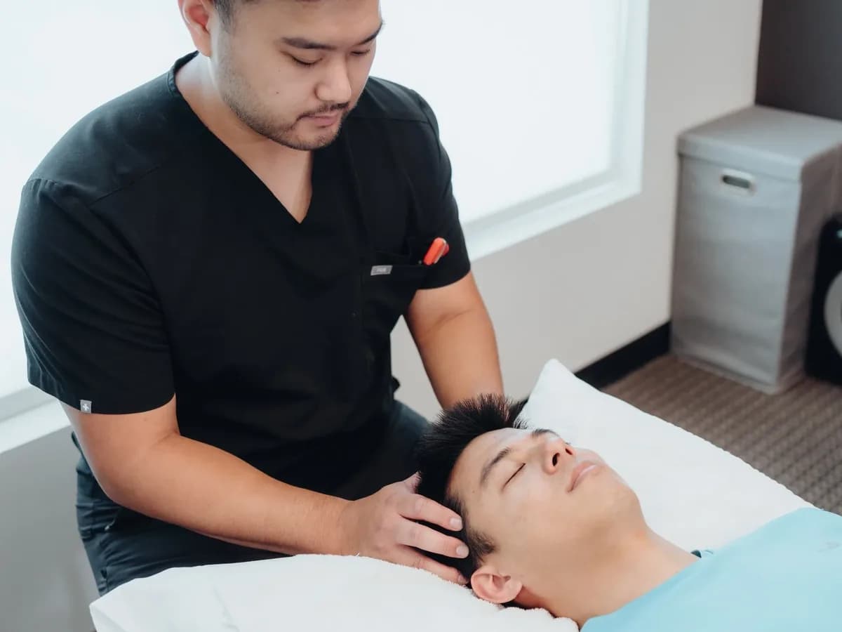 Dr. Joey performing manual therapy